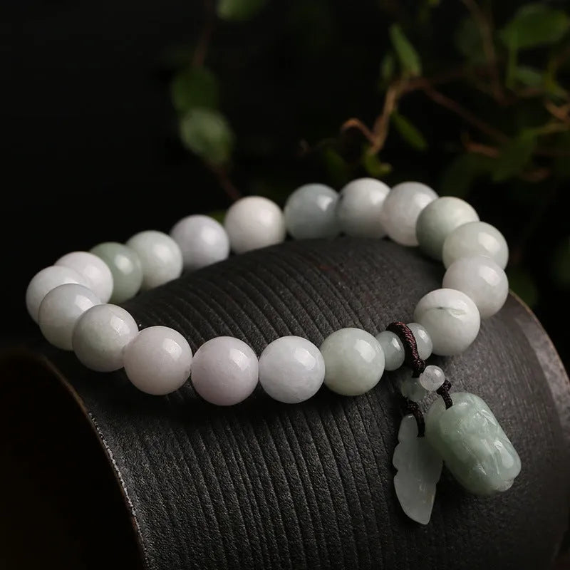 Natural jade bracelet with Maitreya Buddha charm and geometric design