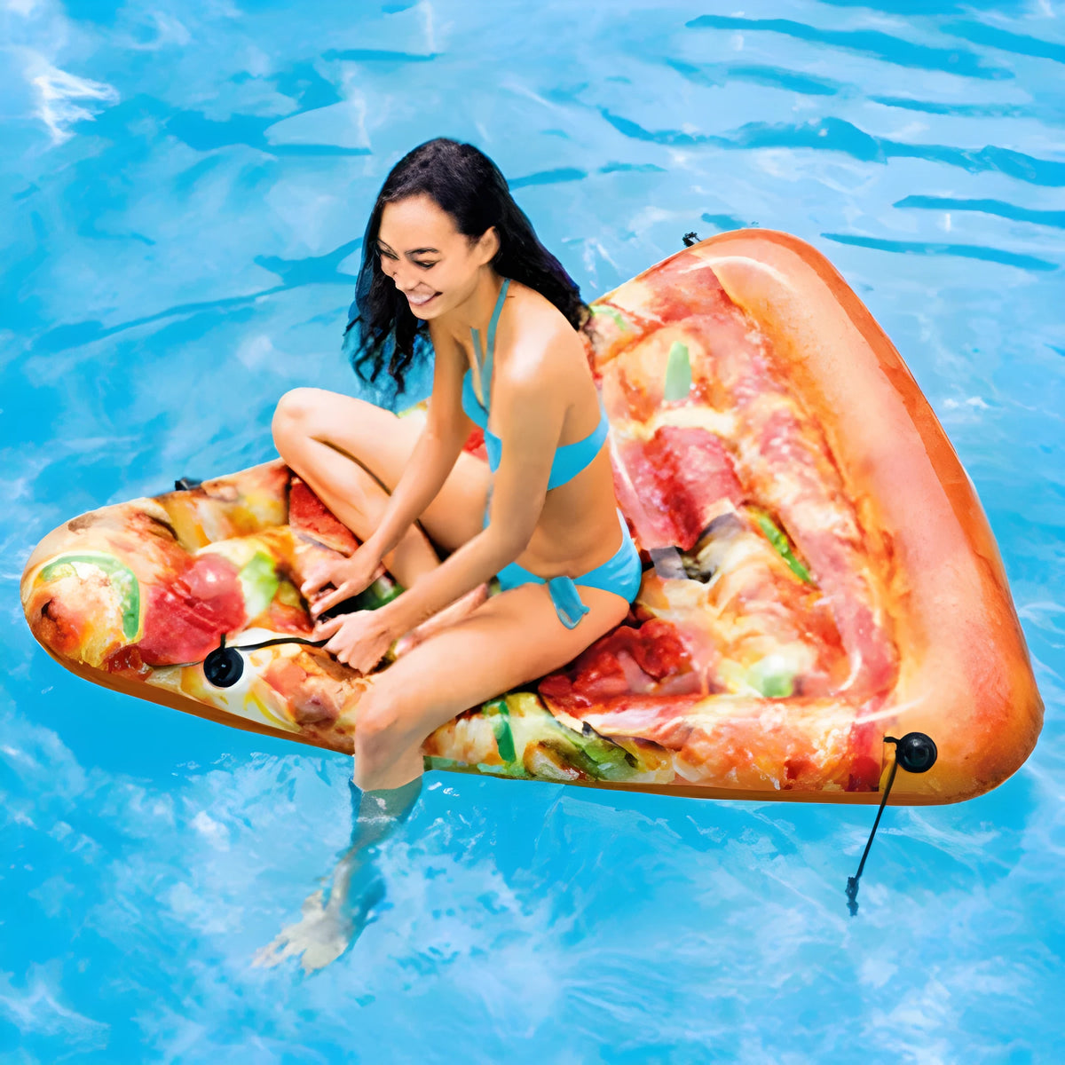 Large inflatable pizza slice surfboard recliner floating in a pool, showing its 175cm length and colourful design.