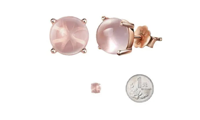 Rose gold drop shape stud earrings with crystal inlay detail on synthetic ross quartz