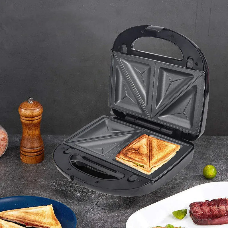 Black double-sided electric sandwich pan with stainless steel lid and non-stick coating.