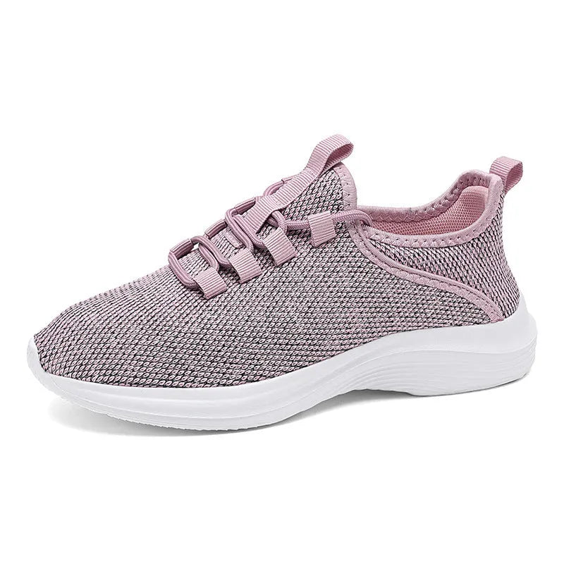 Women's low-top casual sneaker in mesh fabric with round toe and flat sole, shown in black.