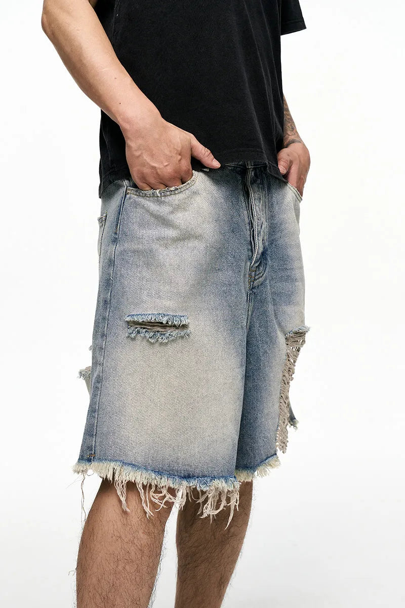 Light blue retro washed men's baggy denim shorts on a mid-waist mannequin.
