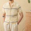 Camel coloured cotton linen blend short sleeve cardigan with lapel collar laid flat