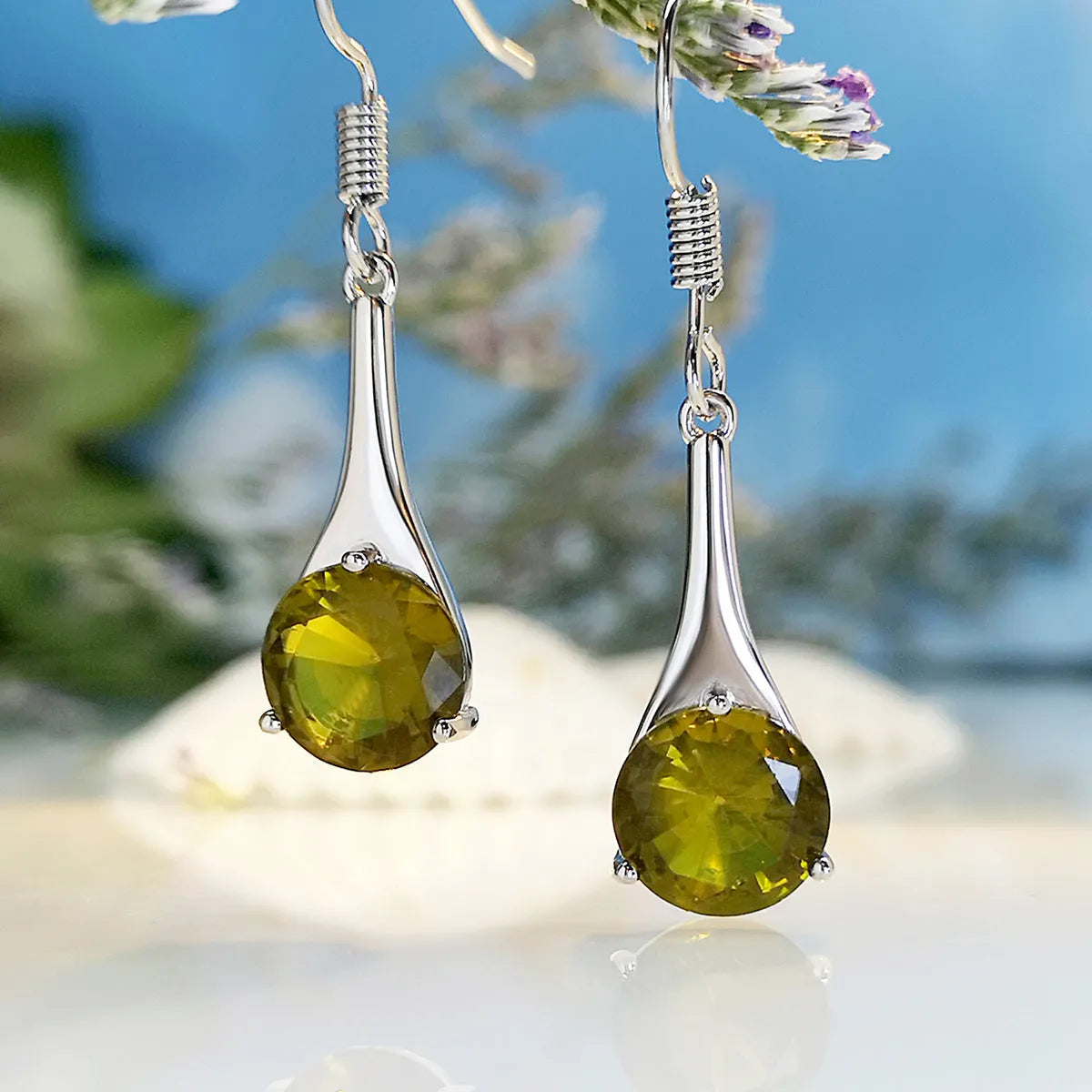 Olive green topaz earrings with water drop shape and retro design on alloy background