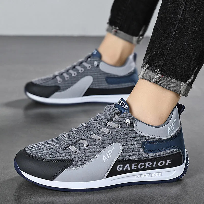 Men's grey and green mesh running shoes with viscose soles and lace-up fastening