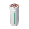 Black wireless USB humidifier with colourful lights on a car dashboard cup holder