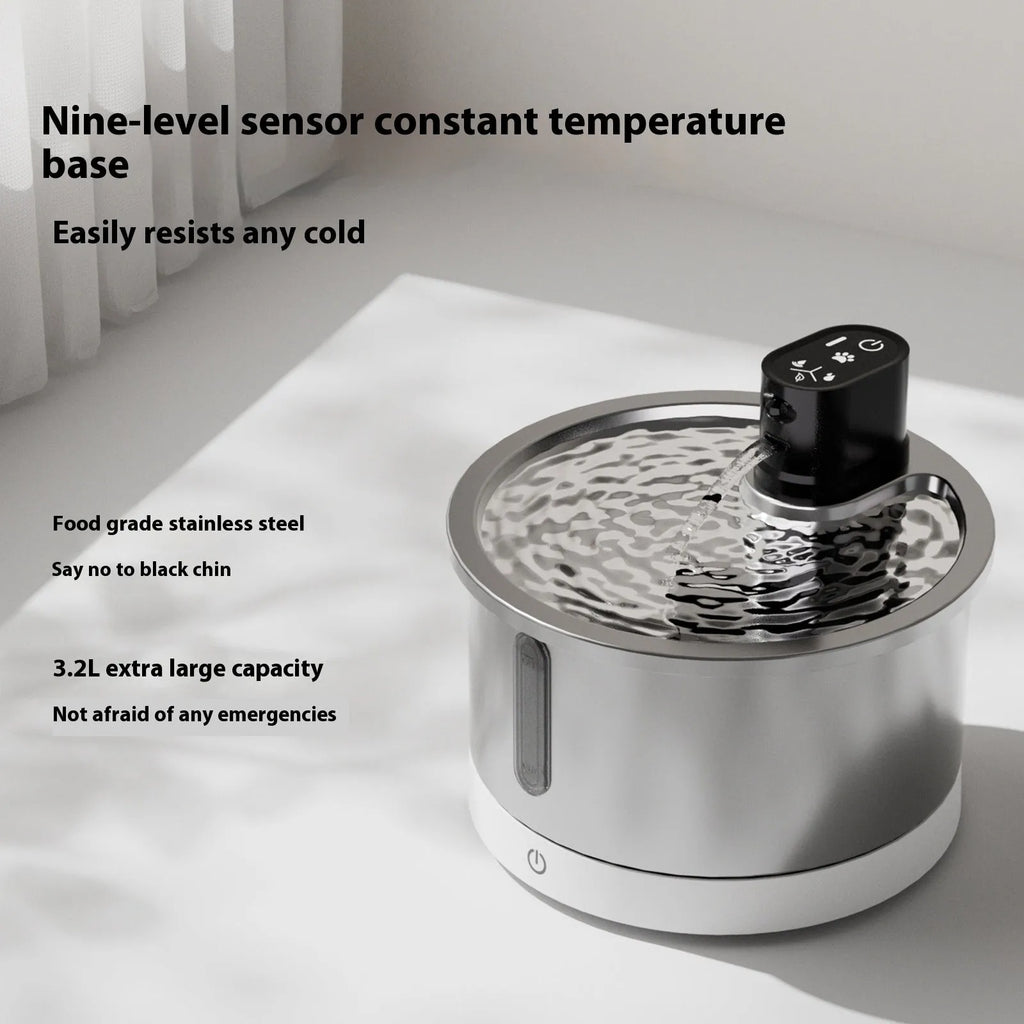 Stainless steel pet water fountain with digital heating base control panel, shown in white colour.