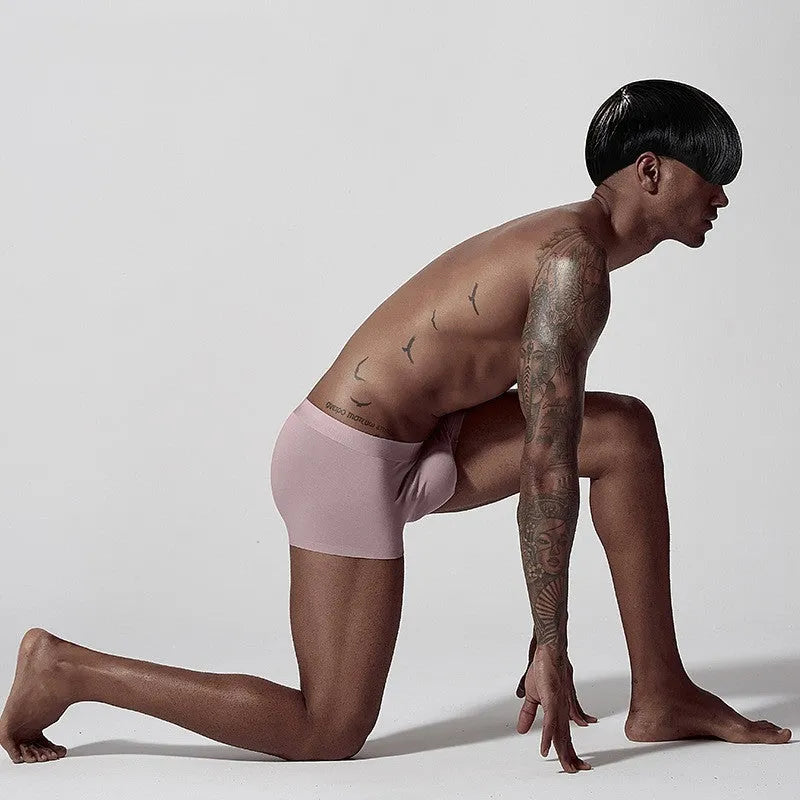 Men's seamless modal underwear in mid-waist style showing white, pink, and green colour options