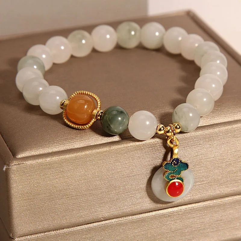 Women's ice jade bracelet with pearl detailing and traditional jade buckle