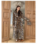 Artificial fur coat with faux fur fabric and fur collar in street fashion style
