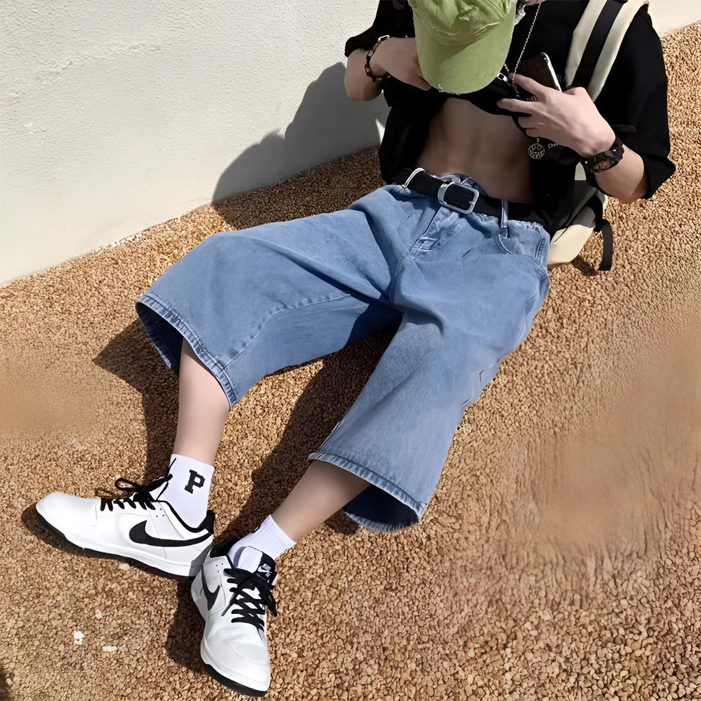 Men's blue washed denim pirate shorts with a straight leg and high waist.