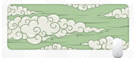 Large Japanese-style cloud pattern desk mat with non-slip rubber base on a wooden desk.