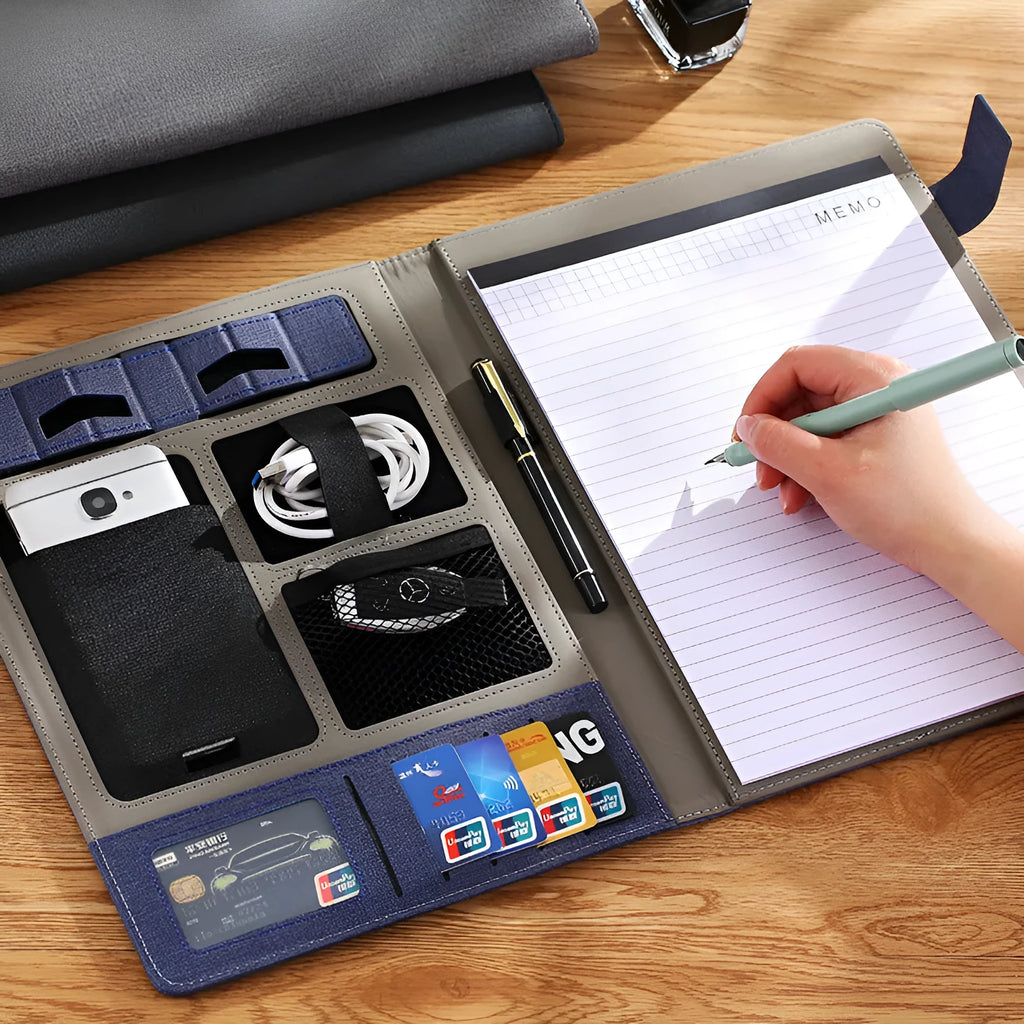 Leather A4 business folder in black, open to show internal notepad and pen.