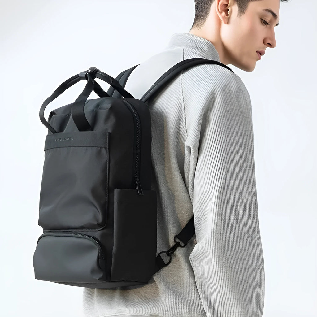Black Oxford cloth computer backpack with a 20-35 litre capacity for laptop storage.