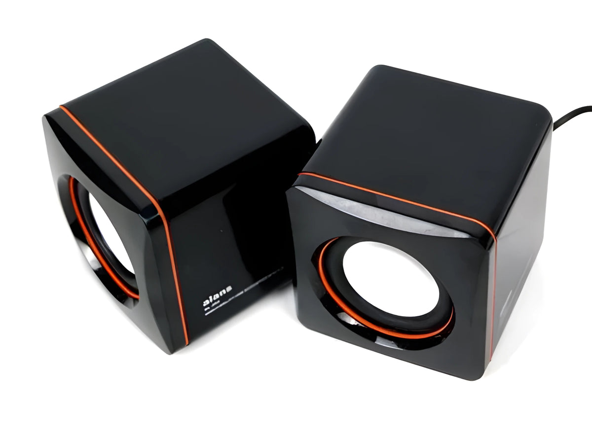 Black square USB-powered 2.0 computer speaker on desk with single cable connection