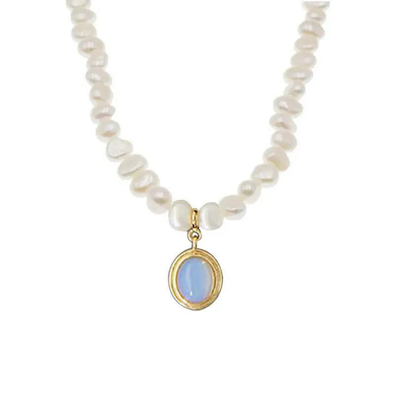 White geometric sterling silver pendant necklace with an irregular pearl on an adjustable chain.