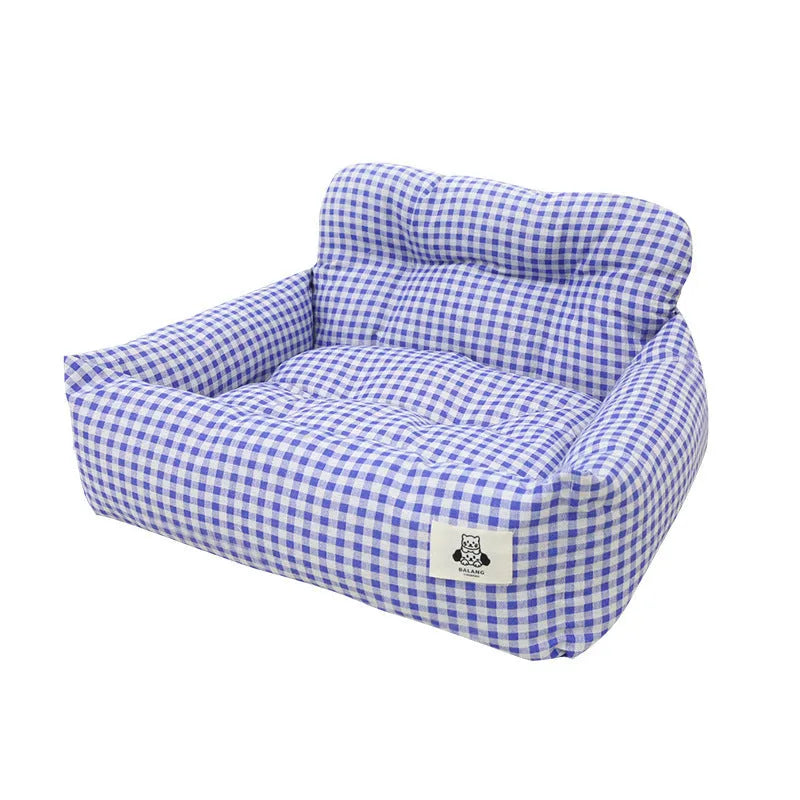 Grey and blue plaid stain-resistant dog carrier for car travel with foldable sides.