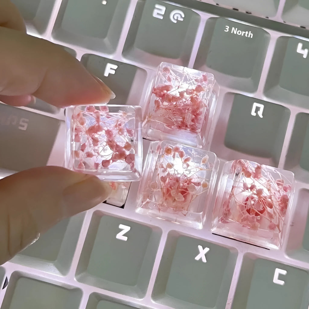 Clear resin mechanical keyboard keycap with starry sky design in green.