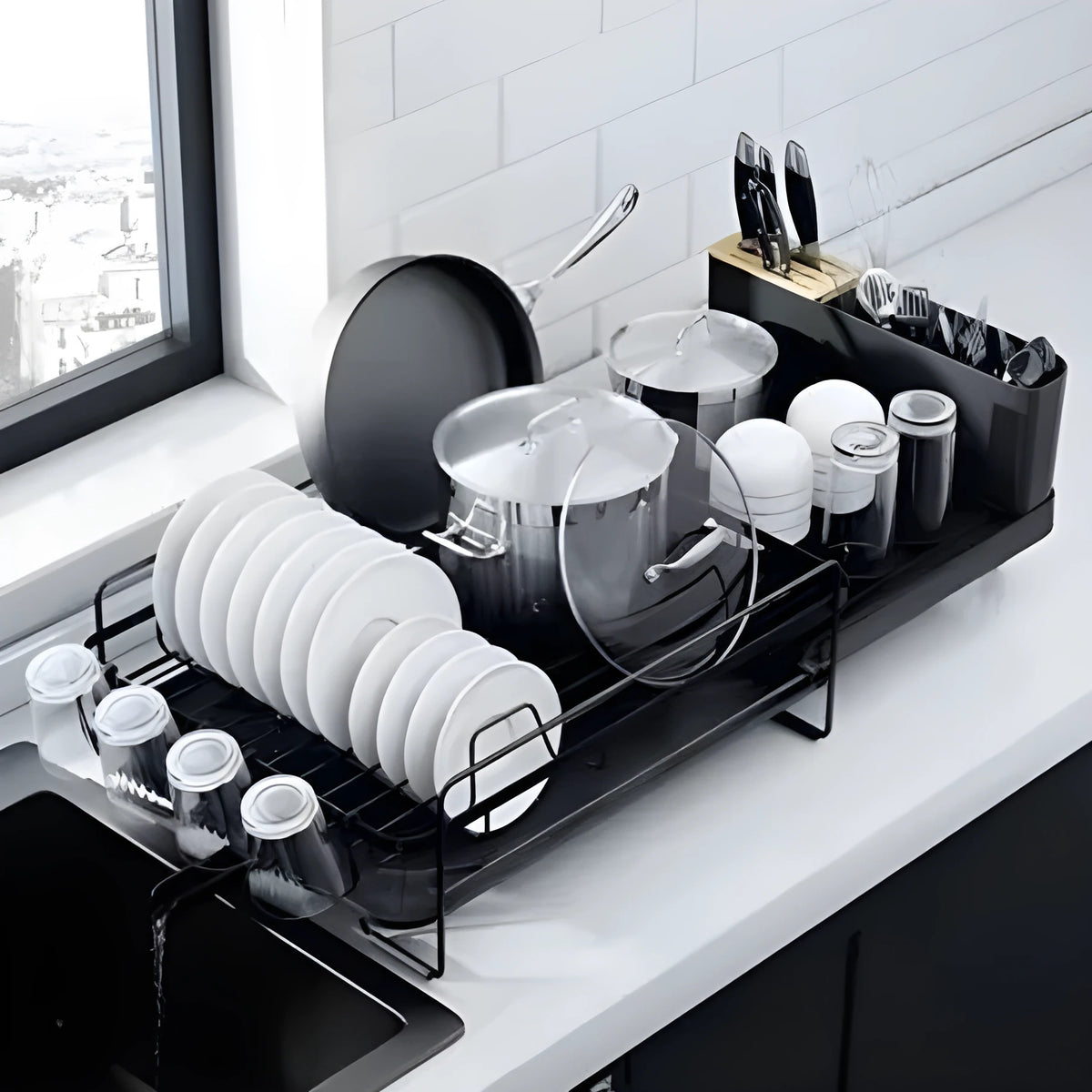 Carbon steel foldable kitchen drain rack for cutlery and cups on a countertop.