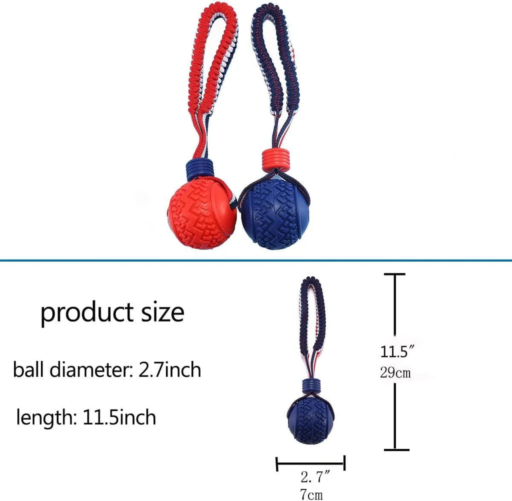 Blue natural rubber dog ball with integrated rope toy on grass, showing textured surface and scale.