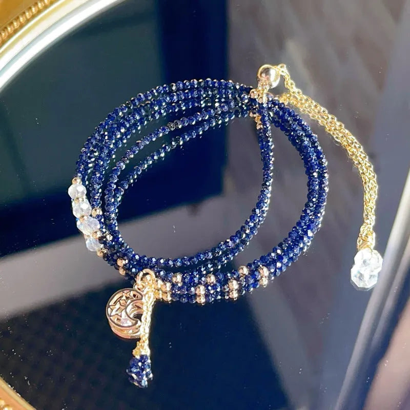 Blue and gold multi-layer women's bracelet with cut sand stone on a three-ring design.