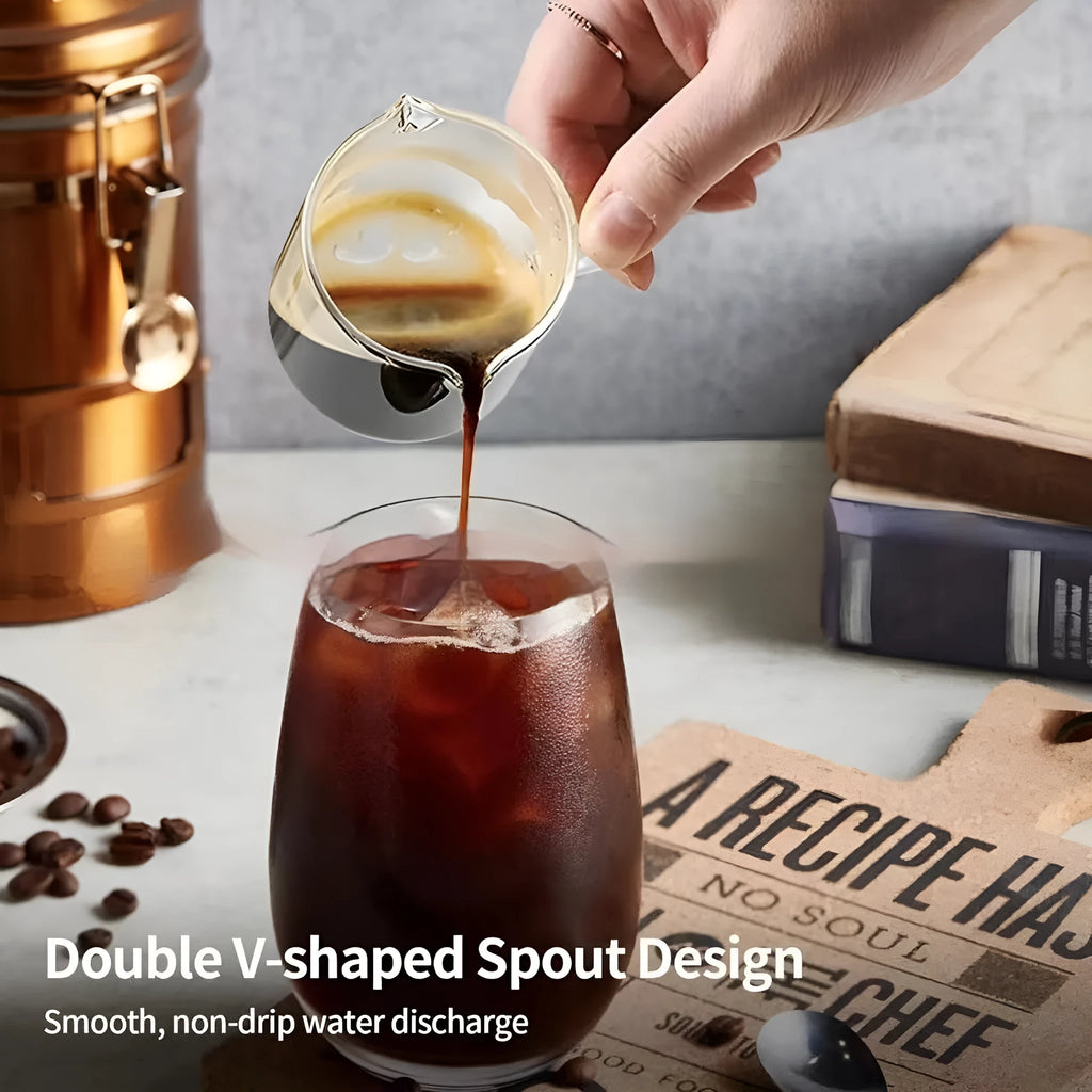 White modern double mouth transparent glass coffee cup set on a table.