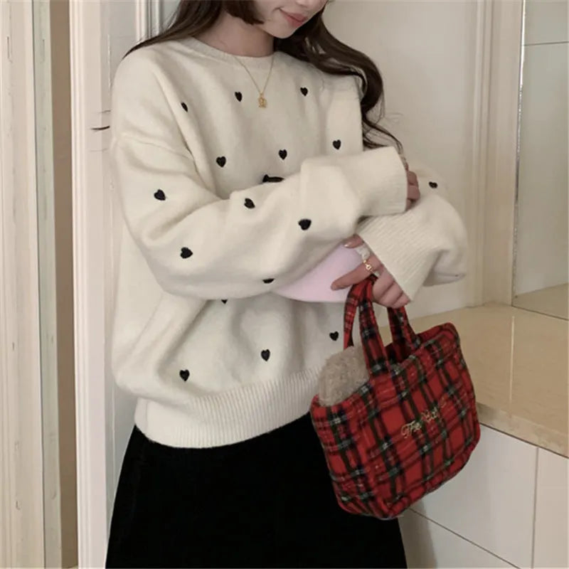Women's loose fit crew neck acrylic sweater with embroidery detail in milky white colour