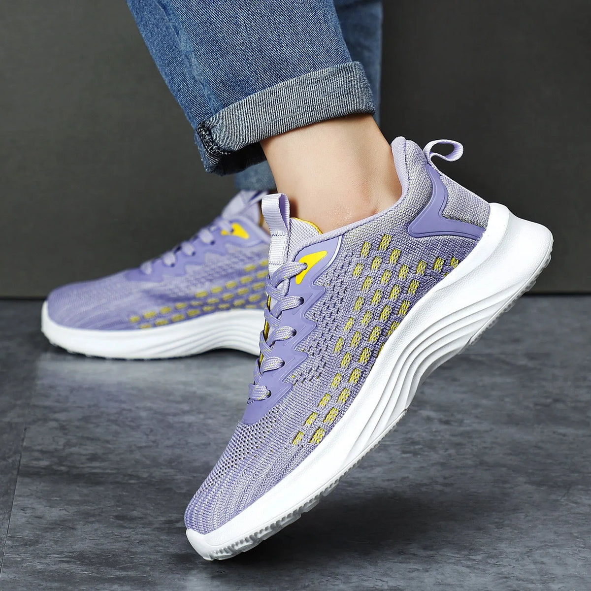 Women's Lavender Purple Flyknit running shoes with mesh upper and striped pattern on an EVA sole.
