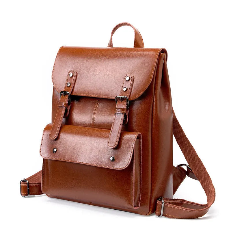 Women's cowhide leather computer backpack in black, brown, or coffee with hard structure and wear-resistant finish