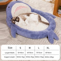 Blue shark pattern pet bed cushion on a hardwood floor, showing non-slip bottom.