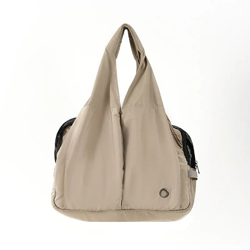 Apricot coloured cloth pet handbag carrier with shoulder strap for small dogs or cats.
