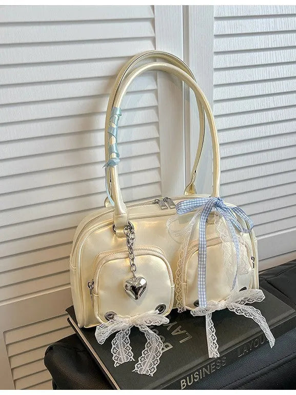 Women's soft PU leather shoulder bag in horizontal square shape with phone compartment.