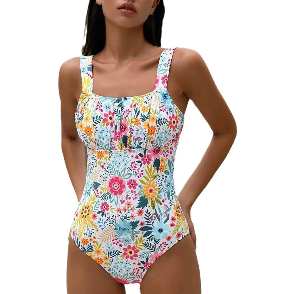 Women's floral print one-piece swimsuit with full back on mannequin.