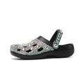 Black women's platform sandals with rhinestone details on an EVA upper and sole.