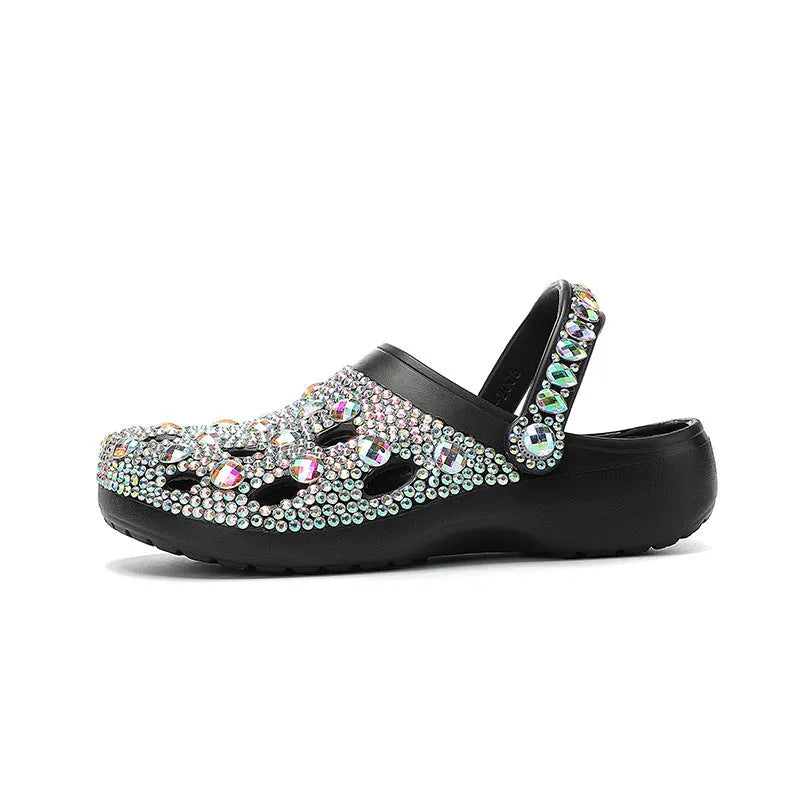 Black women's platform sandals with rhinestone details on an EVA upper and sole.