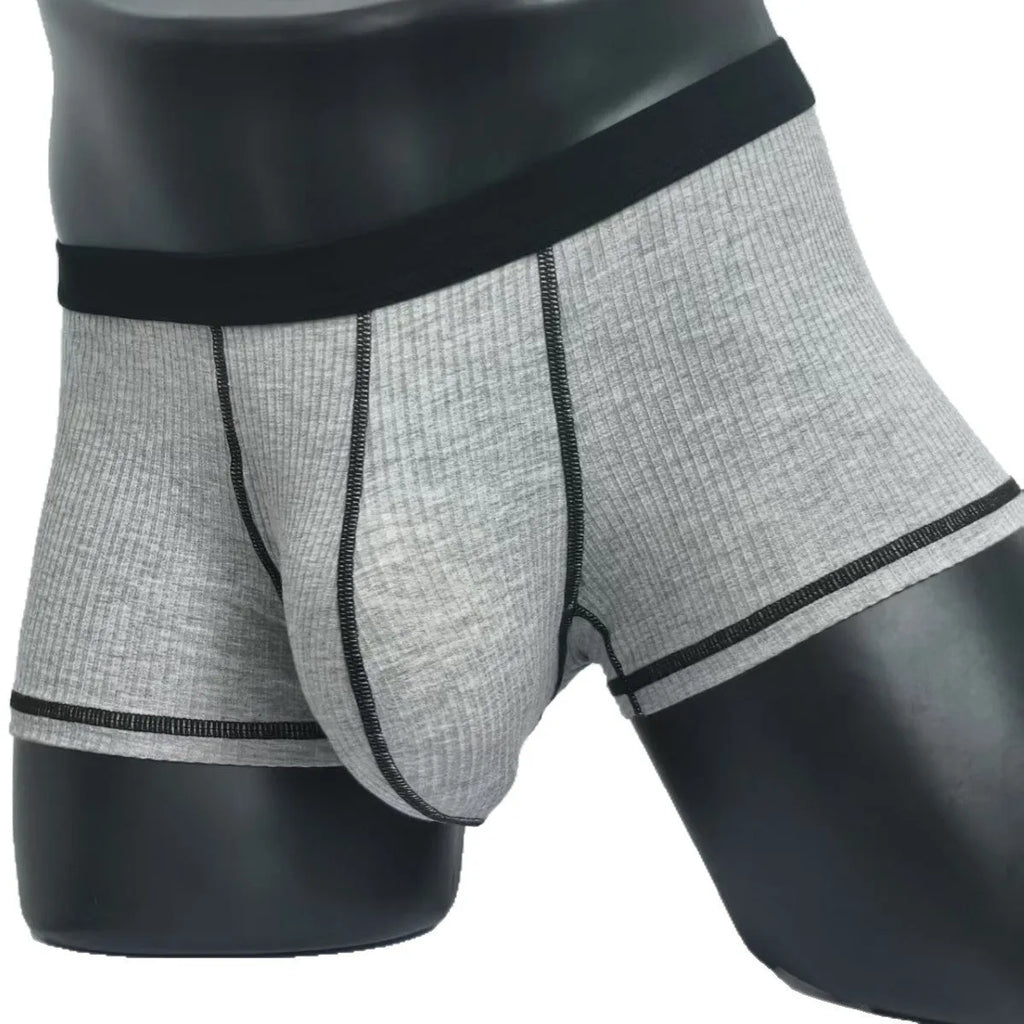 Men's solid colour boxers in Army Green shown flat, highlighting thin breathable fabric and body shaping design.
