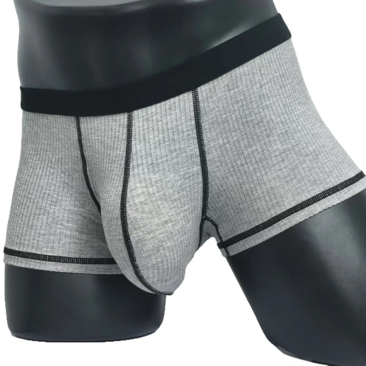 Men's solid colour boxers in Army Green shown flat, highlighting thin breathable fabric and body shaping design.