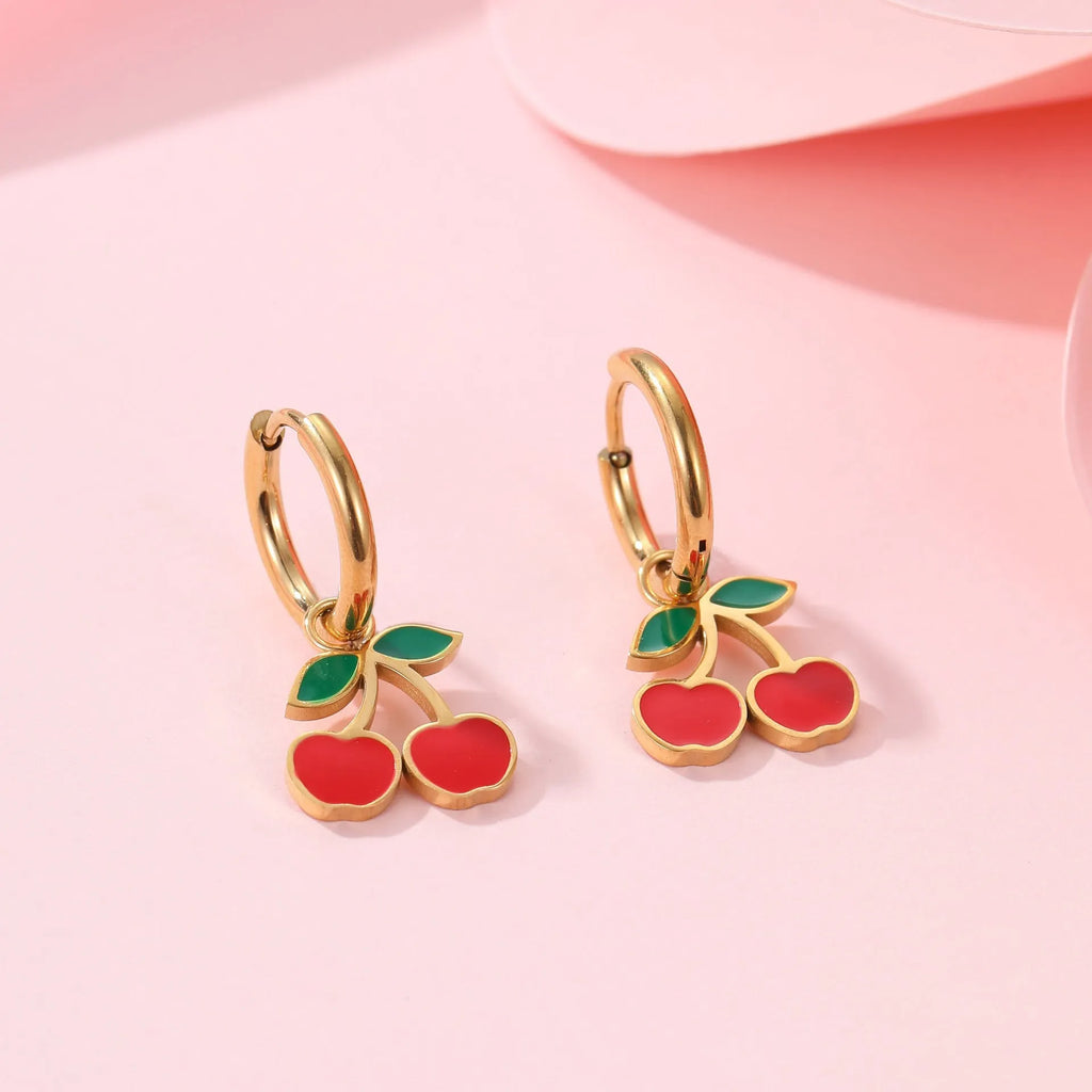 Cherry jewellery set showing necklace, bracelet, earrings, and ring with stainless steel construction and gold plating