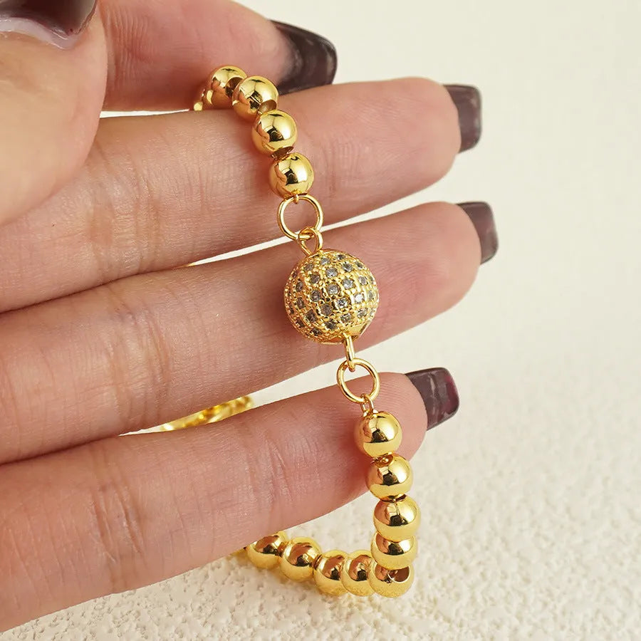Women's copper bracelet with heart-shaped Arabic design and zircon stone detailing