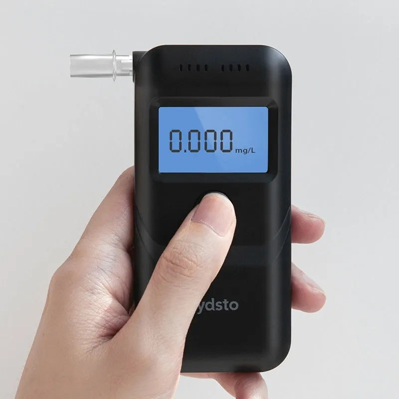 Black handheld personal alcohol breath tester, model HD-JJCSY01, on a plain background.