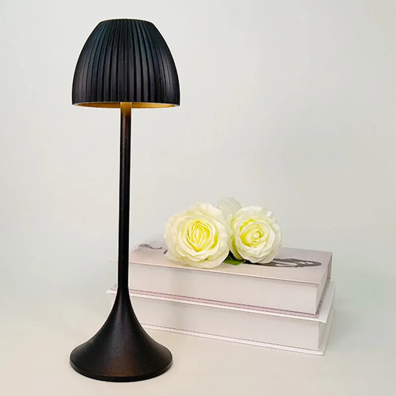 Ins pattern dimming small night lamp in thin round base black or white on a table.