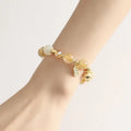 Gold coloured rutilated quartz crystal bracelet with electroplated finish in Korean style.