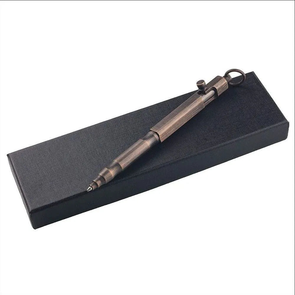 Brass tactical pen with hexagonal bolt design and machine gun aesthetic on a dark background.