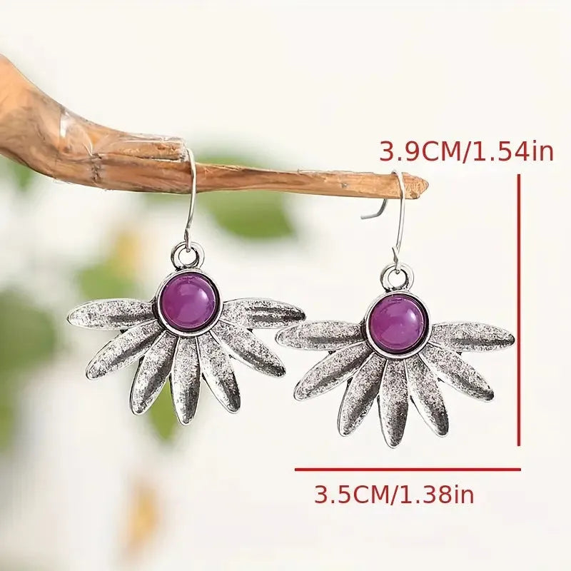 Purple bohemian-style earrings with animal and Zodiac modelling in resin and alloy.