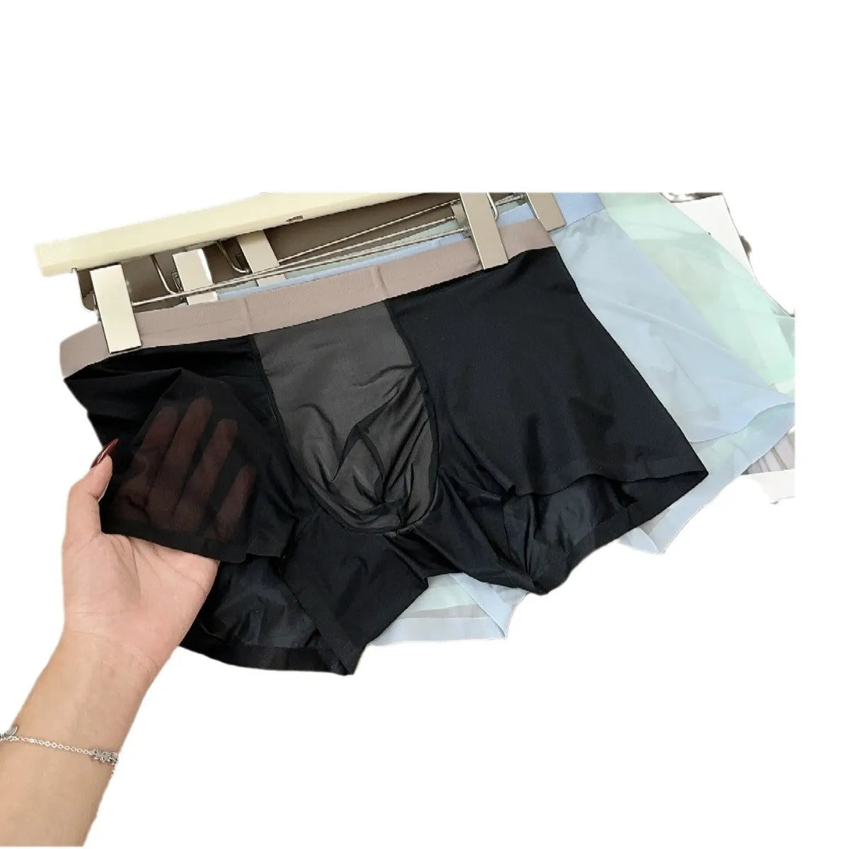 Seamless ultra-thin men's boxers in Ice Silk fabric showing the honeycomb crotch design.