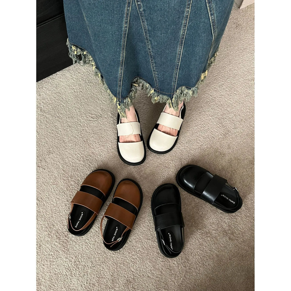 Retro brown women's ankle-strap buckle sandals with a closed toe and microfiber upper.