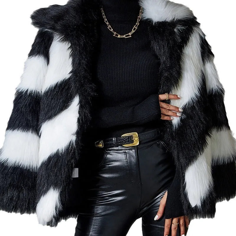 Women's faux fur coat with dark contrast lapels and a light fur collar.