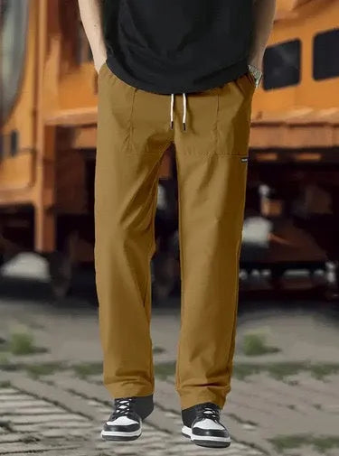 Men's polyester trousers in light grey colour shown flat