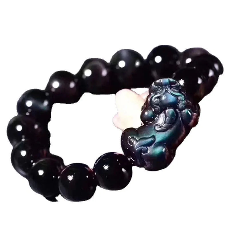 Natural grey obsidian crystal beaded bracelet shown in multiple bead size options on a wrist.