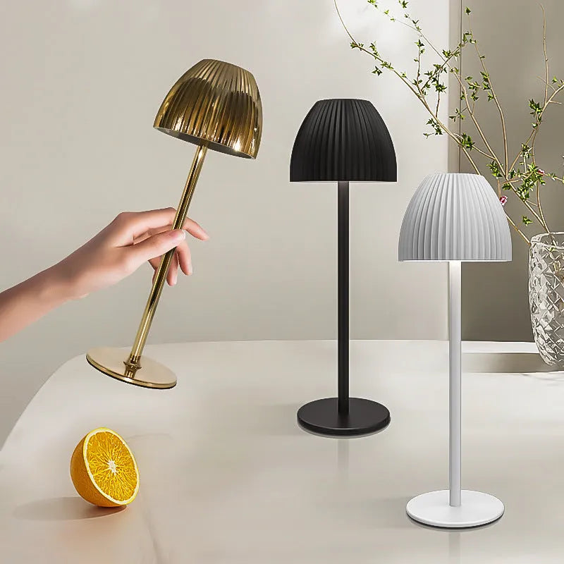 Ins pattern dimming small night lamp in thin round base black or white on a table.